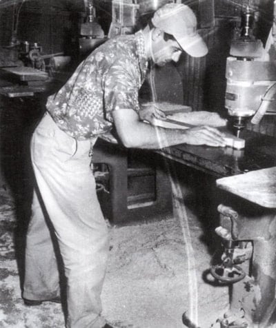 A worker Shaping an headstock with a router, 1952