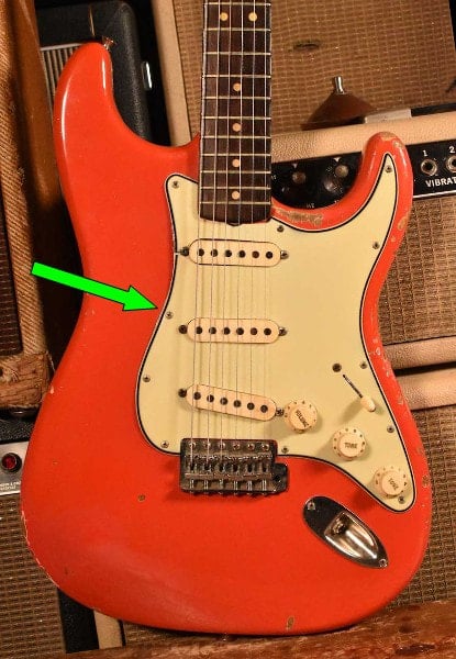 1964 Stratocaster, the second upper screw of the pickguard was relocated closer to the middle pickup