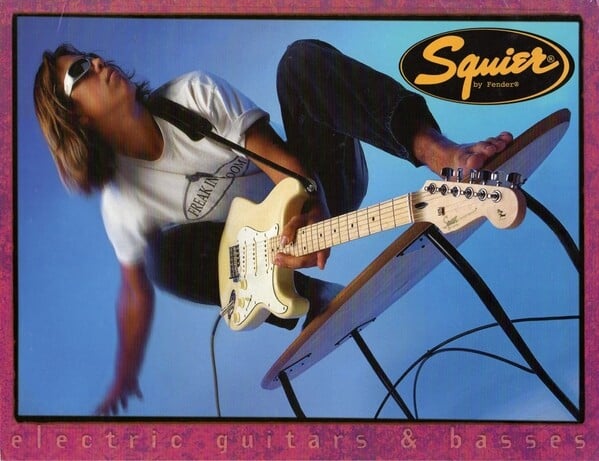 Squier Pro Series advert, 1996 Fender Frontline.  For guitarists of a certain vintage, this ad might have recalled the series of classic '50s and '60s Fender ads, headlined You Won't Part With Yours Either, which featured guitars in unlikely outdoor action settings.