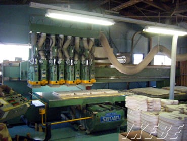 Wooden boards, already selected and dried, are cut in this machine to craft bodies and necks