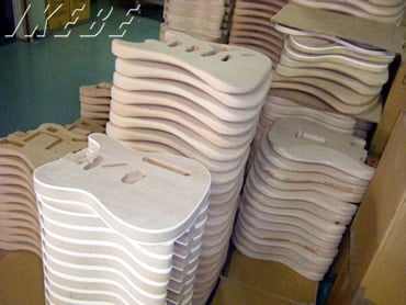 After sanding, the wood is carefully stacked paying much attention to humidity. It is only at this point that a code, which indicates the model, is engraved in the neck pocket.