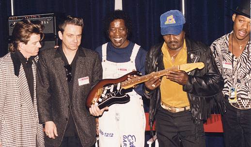 1992, opening presentation of the signature, with Stevie's brother Jimmie, the Double Trouble drummer, Chris Layton, and Buddy Guy, Albert Collins and a very young Eric Gales