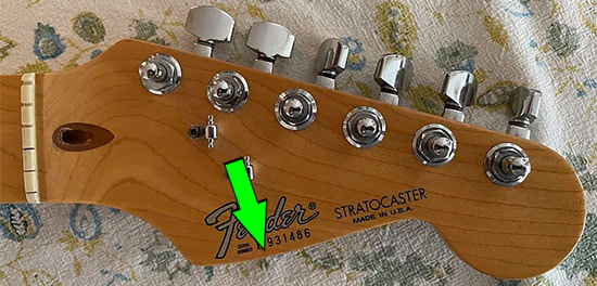 Headstock of an American Standard Strat, first series. Lower curve is pronounced