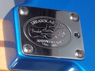 In 2004 all factory Fender Stratocasters had the 50th anniversary commemorative neck plate