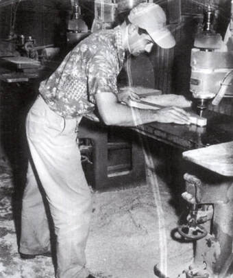 A worker Shaping an headstock with a router, 1952. Photo from “Fender, The sound heard 'round the world” by Richard R. Smith