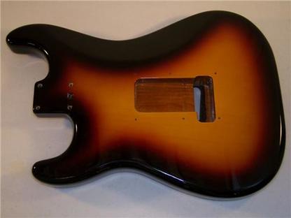 Sunburst finish in which the whole back concavity was black hide a veneer top and back body