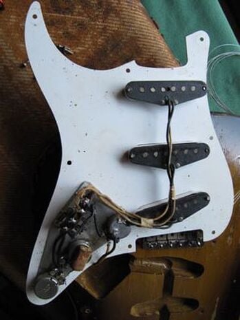 1956 pickguard with the shielding foil that covered the control area only