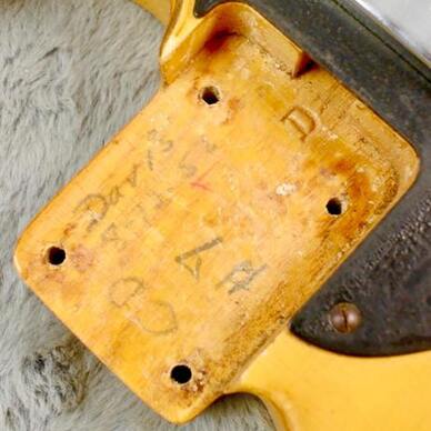 The neck pocket of the Blackguard owned by Eddie Tatton. It is dated August 1952 and marked by 