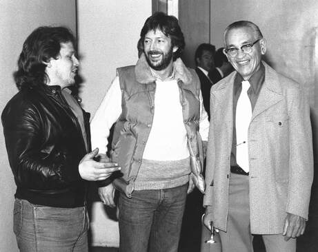 John Page and Freddie Tavares with Eric Clapton in 1983
