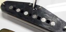 Square holes in SQ Strat pickup; CST models did not have these pickups