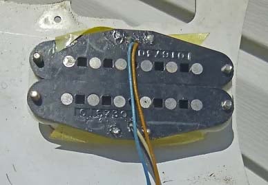 The dual-pickup used on the humbucker version. All 1st and 2nd generation Fender Bullets pickups featured the code 016730 on the bottom plate, which was the Fender part number for the molded plastic bobbin