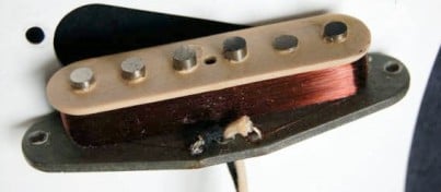 Gray Bottom pickup with white plastic top, sometimes used on the very first export guitars 