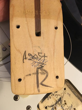 Neck heel of an I Series Strat Made in USA. The neck pocket was dated 1990.