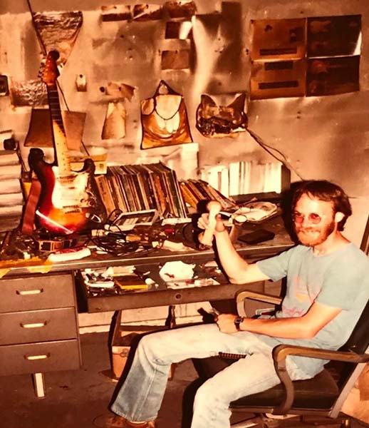 John Ziegler sitting at a desk after the fire