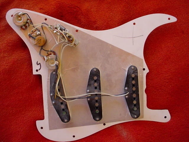 1982 Stratocaster; the metal shielding under the pickguard covered pickups and control area