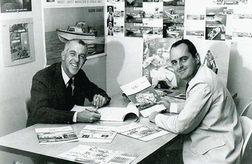 Bob Perine, on the left, and Ned Jacoby, on the right, at the Newport office