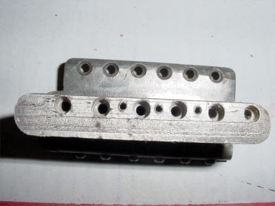 The inertia bar of the prototype was drilled on the back for three springs, not five