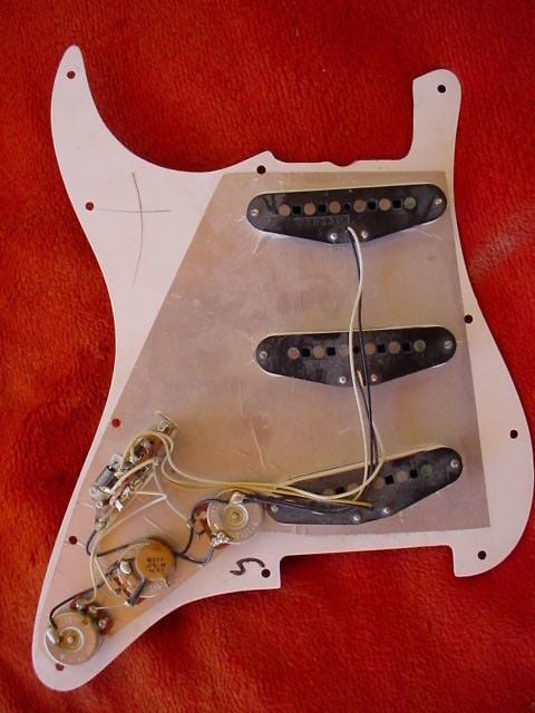 1982 Stratocaster; the metal shielding under the pickguard covered pickups and control area