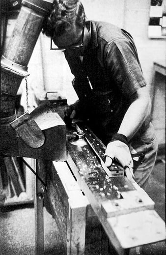 Fender employee carving a neck. Note the neck date was already present. (Photo: 