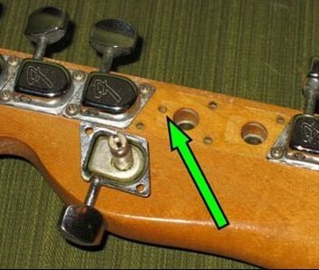 Pin router's hole, back of the headstock. Courtesy of Real Vintage