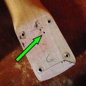 Pin router's hole underneath the neck's heel of a 1959 Stratocaster