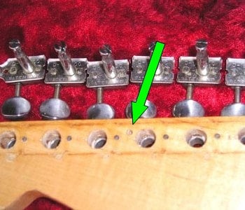 Pin router's hole under the tuning machine of a 1957 Stratocaster 