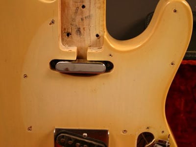 The very first dual pickup guitars and those made after the Summer 1969 didn's sported the diagonal route. 1971 Telecaster, Courtesy of Real Vintage
