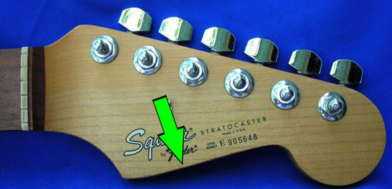 US Squier Strat headstock, note the lower curve